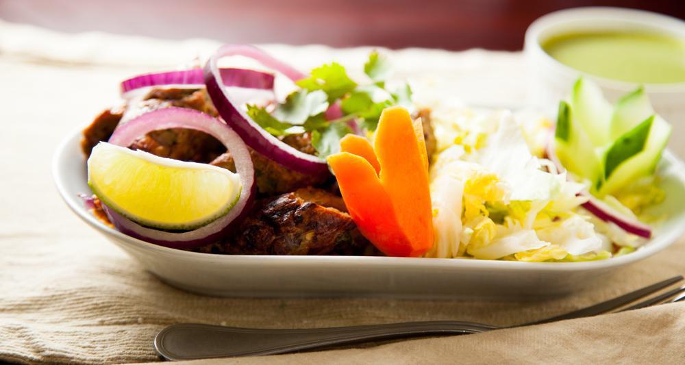 Chicken Shish Kebab · Minced chicken marinated with spices and cooked on skewers in clay oven.