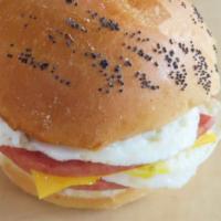 Taylor Ham, Egg & Cheese Sandwich · (2) slices of taylor ham topped with egg & american cheese on a kaiser roll