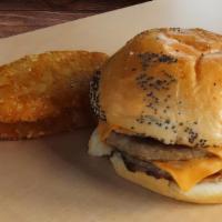 Sausage & Cheese Sandwich · Two sausage patties each topped with a slice of cheese on a Kaiser roll