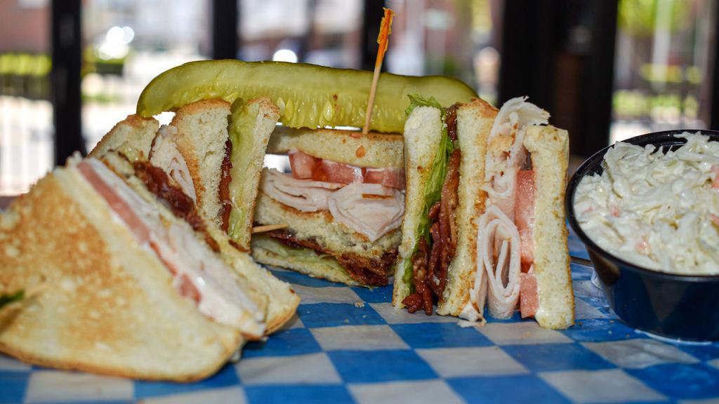 Turkey Club Sandwich · Turkey with bacon, lettuce, tomato & mayo with coleslaw & pickle spear., on your choice of white, rye or wheat bread.