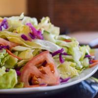 Fresh Garden Salad · Iceberg lettuce topped with tomatoes, cucumbers, and carrots. Add chicken for an additional ...
