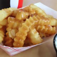 Gravy Fries · Our signature fries topped with gravy. Serves 2