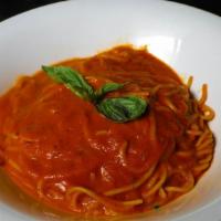 Spaghetti Al Pomodoro · Tomato basil parmigiana olive oil.