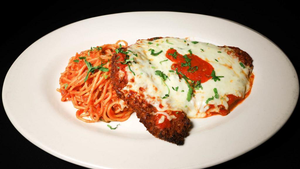 Veal Parmigiana · Breaded veal tomato sauce and mozzarella comes with pasta.