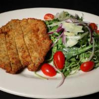 Veal Milanese · Breaded veal with arugula salad topped with shaved parmesan cheese, cherry tomato.