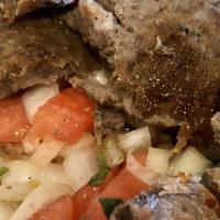 Gyro-Doner · Layer of marinated ground meat, wrapped around the large vertical split.