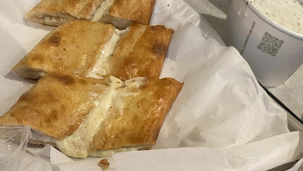 Cheese Pie · A thick dough crust stuffed with Turkish kashari cheese.