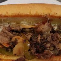Sheppard Philly Cheesesteak · Philly style cheese-steak made with rib eye beef, caramelized onions, american cheese in a h...