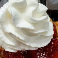 Carnival Style Funnel Cake · Delicious funnel cake cooked golden brown served with strawberry filling, powdered sugar & w...