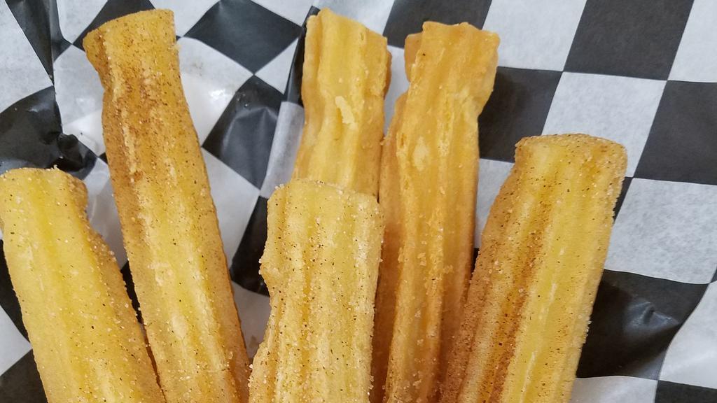 Cinnamon Sugar Churros · Mouthwatering fried golden brown churros (6 pcs) coated with cinnamon & sugar.
