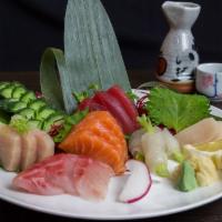 Sashimi Deluxe · 18 pieces sashimi and rice.