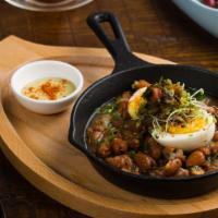 Fava Beans On Skillet · Fresh tomato sauce, shallots, jalapeños, and boiled egg.