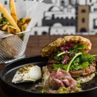 Big B’S Lamb Burger · Pretzel buns, labneh gruyere cheese, pickled red onions, and cornichons. Served with your ch...