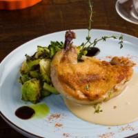 Succulent Chicken Breast · Porcini mushrooms and peppercorn sauce. Served with brussels sprouts.