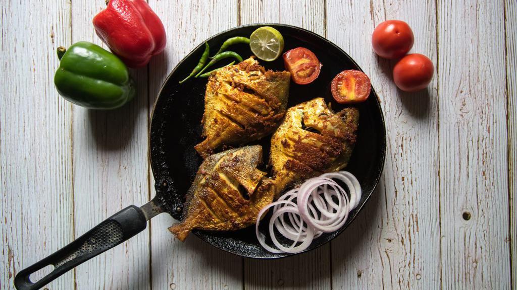 Tandoori Pomfret · Whole Indian Fish Marinated in Spiced Yogurt Sauce Cooked in the Clay Oven.