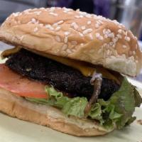 Soulkofa Burger · Plant-based burger, spices, lettuce, tomato, special sauce. Served on a bun.