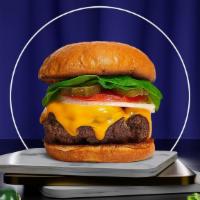 Cheese Chaser Burger · Your choice of grilled or fried patty topped with melted cheese, lettuce, tomato, onion, and...