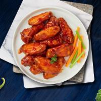 12-Piece Hot Wings · Fresh chicken wings breaded, fried until golden brown, and tossed in hot sauce.