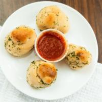 Garlic Knots · With marinara sauce.