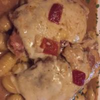 Chicken Sorrentino · chicken breast topped with breaded eggplant, prosciutto, and melted fresh mozzarella.