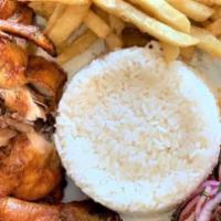 Arroz Con Pollo · Rice with chicken and French fries.