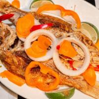 Escoveitched Fish · Served your choice of White Rice or Rice and Peas, Plantain, and Vegetables