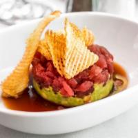 Yellowfin Tuna Tartare · A true delicacy made to order. Hand-cut sushi grade yellowfin tuna placed on top of crushed ...