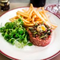 Sirloin Steak Tartare · Made to order. Hand-cut sirloin steak topped with a quail egg, fried capers, French cornicho...