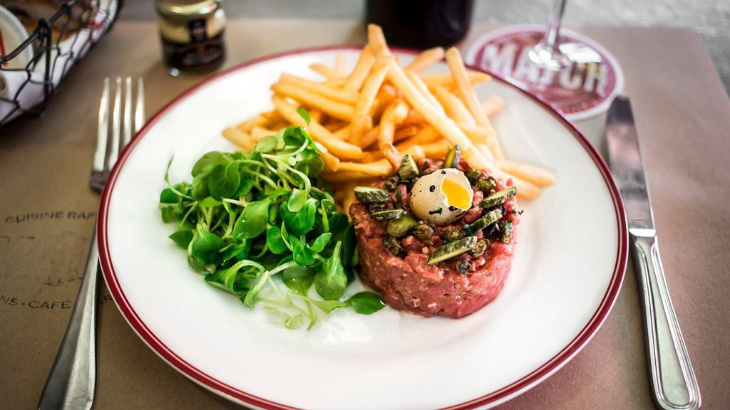 Sirloin Steak Tartare · Made to order. Hand-cut sirloin steak topped with a quail egg, fried capers, French cornichons pickles and toasts.