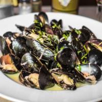 Mussels Marinières Appetizers · Prince Edward Island mussels served with roasted garlic, shallots, parsley and white wine sa...