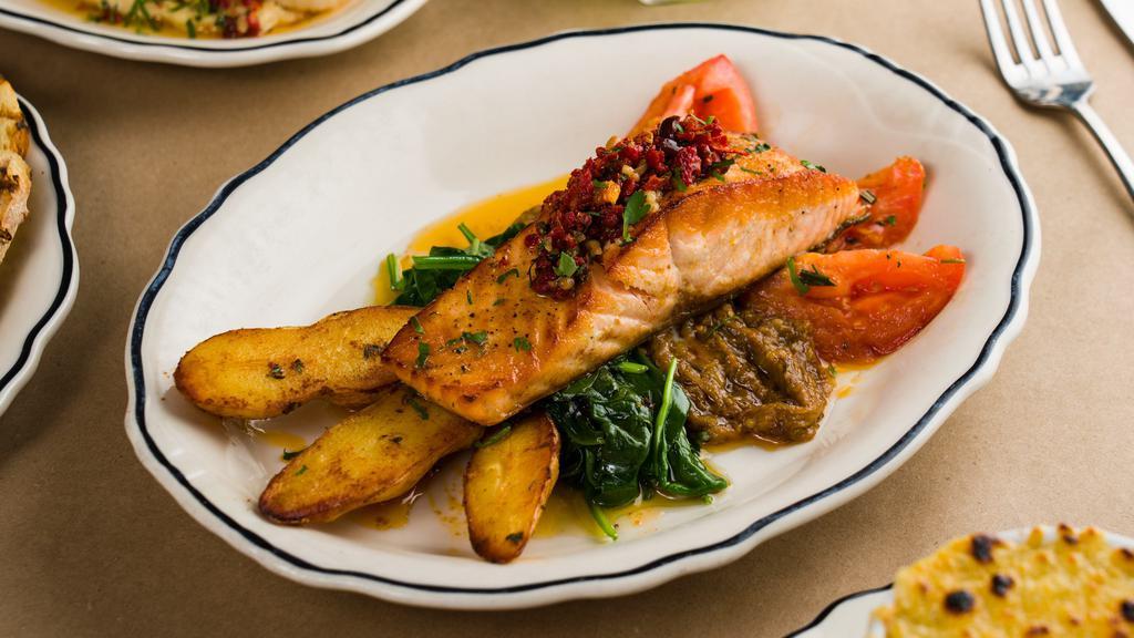 Fillet Of Atlantic Salmon · Super Healthy; Seared on the skin, served with a purée of eggplant, fingerling potatoes, roasted tomatoes, pine nuts and black olives tapenade.