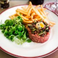 Grass Fed Sirloin Steak Tartare · Made to Order; Hand-cut sirloin steak topped with a quail egg, fried capers and French corni...