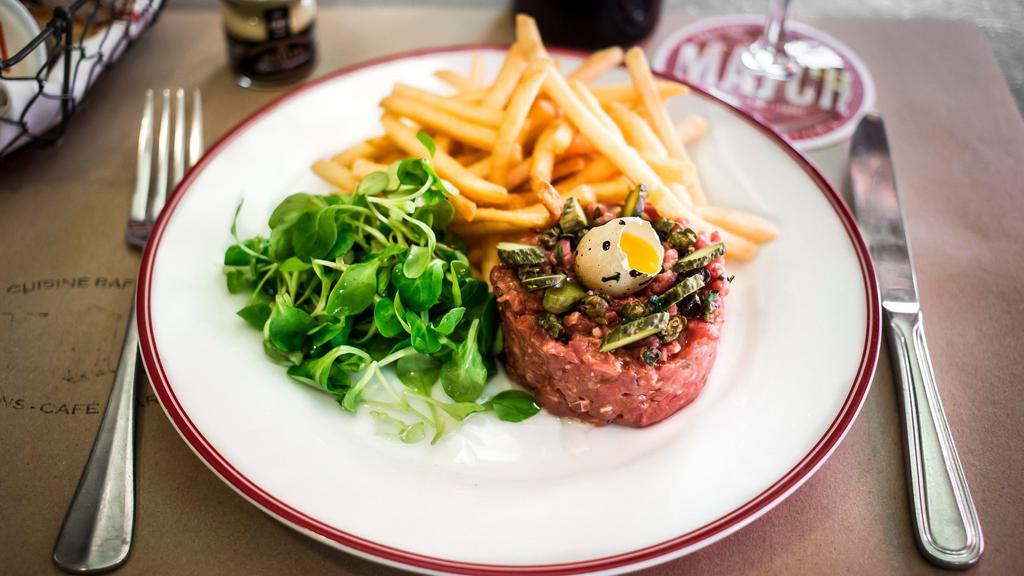 Grass Fed Sirloin Steak Tartare · Made to Order; Hand-cut sirloin steak topped with a quail egg, fried capers and French cornichons pickles. Includes a side of your choice