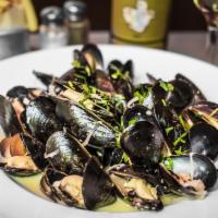 Mussels Marinières Main Course · Prince Edward Island mussels served with roasted garlic, shallots, parsley and white wine sa...