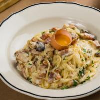 Spaghetti Carbonara · With a touch of cream, bacon lardons, Parmesan cheese and egg yolk.