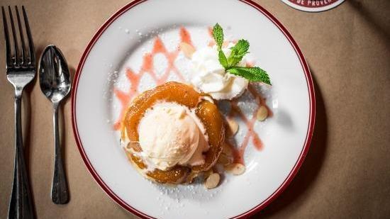 Apple Tart Tatin · Upside down apple tart topped with vanilla ice cream.
