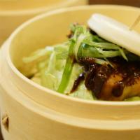 Pork Chashu Bao · Pork chashu, fluffy steamed bun, spring mix, house BBQ teriyaki sauce, scallions, whole papr...
