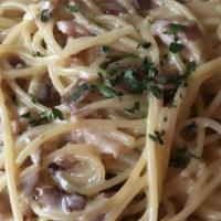 Spaghetti Carbonara · Bacon, onion & a touch of cream.