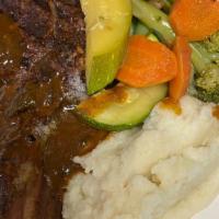 Veal Chops · Grilled with fresh rosemary served with mashed potatoes