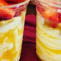 Yogurt Parfait · Vanilla yogurt, granola, fresh strawberries and mango.