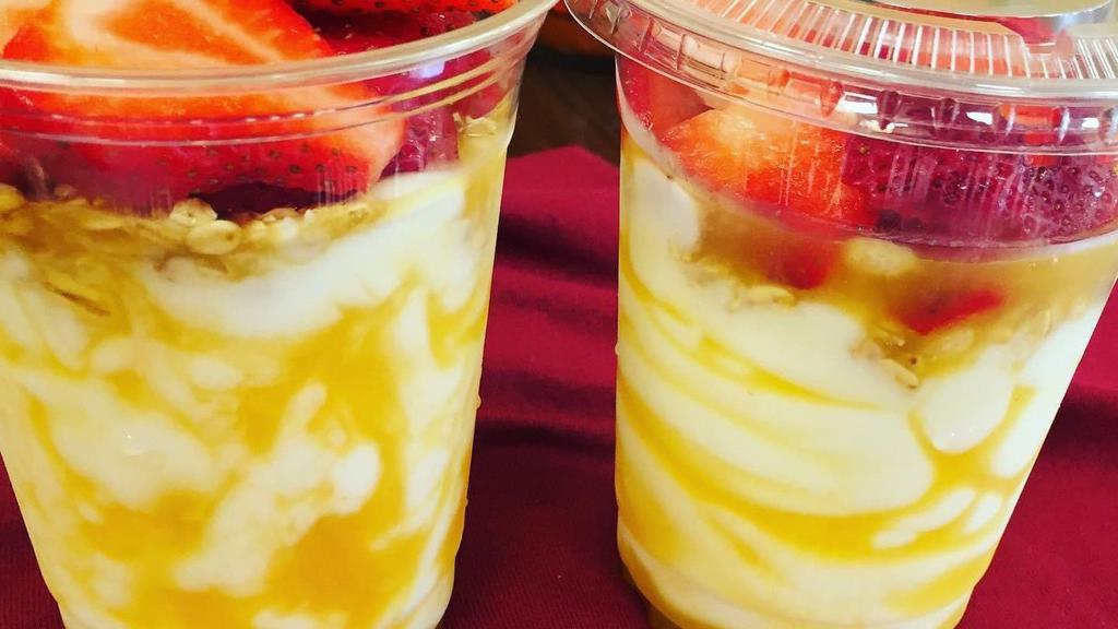 Yogurt Parfait · Vanilla yogurt, granola, fresh strawberries and mango.