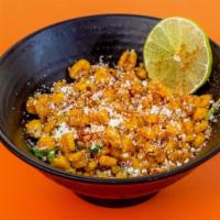 Mexican Street Corn · Roasted mexican corn off the cob, lime juice, cotija cheese, cilantro, spicy panko and cayen...