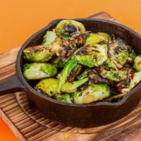 Hot Honey Brussels Sprouts · Beautifully charred brussel sprouts with red chili flakes and hot honey drizzle.