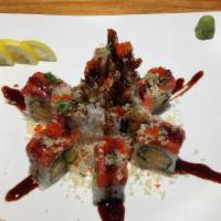 Volcano Roll · Spicy. Shrimp tempura, avocado, spicy tuna, crunchy and eel sauce on top. Wrapped with seawe...