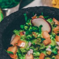 Guacamole Fresco {32Oz} · Avocado, cilantro, onions, jalapeños, tomato, and lime juice,