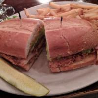 Crispy Chicken Sandwich · Buttermilk battered chicken breast, bacon, pickles, cheddar, lettuce, tomato, and onion, wit...