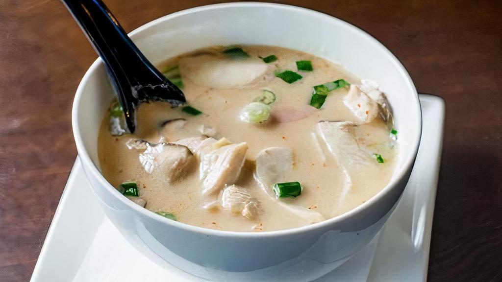 Tom Kha · Simmered aromatic herb with coconut milk for milder and slightly creamy with mushroom, scallion, and cilantro. Choice of shrimp, chicken, vegetable, or tofu.
