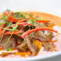 * Panang Curry · Spicy. Panang curry paste, simmered with coconut milk, kaffir lime leaves, bell pepper, stri...