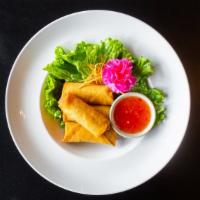 A-2. Thai Spring Roll (4 Pieces) · Stuffed with mixed vegetable and glass noodle served with sweet and sour sauce.