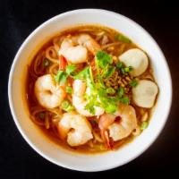 N-4. Tom Yum Noodle Soup · With rice noodles, fish ball, bean sprouts, scallions, cilantro, ground peanut, and fried ga...